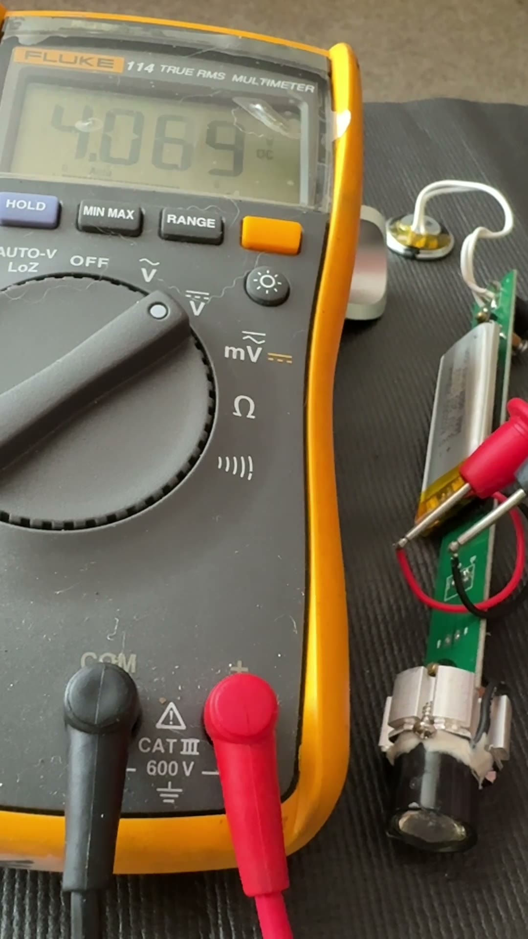 Probing the battery to check voltage