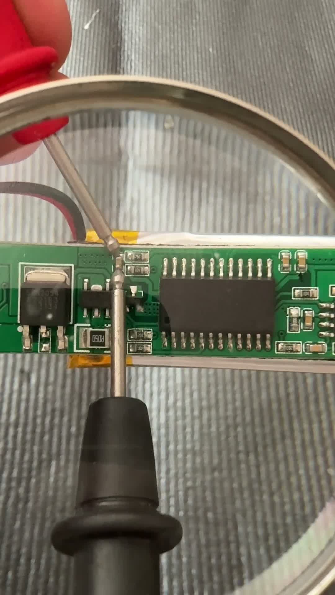 Probing the ceramic resistors to check resistance