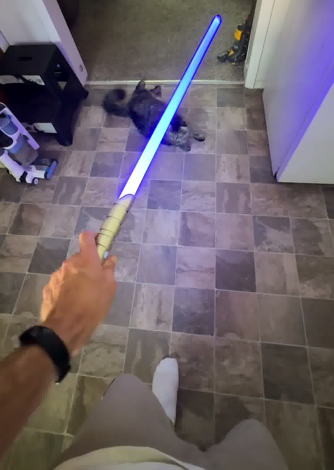 The lightsaber fully repaired and lit up